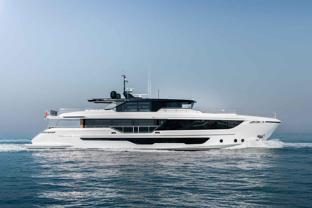 A white motor yacht underway in the sea, presented at the Dubai International Boat Show 2023.